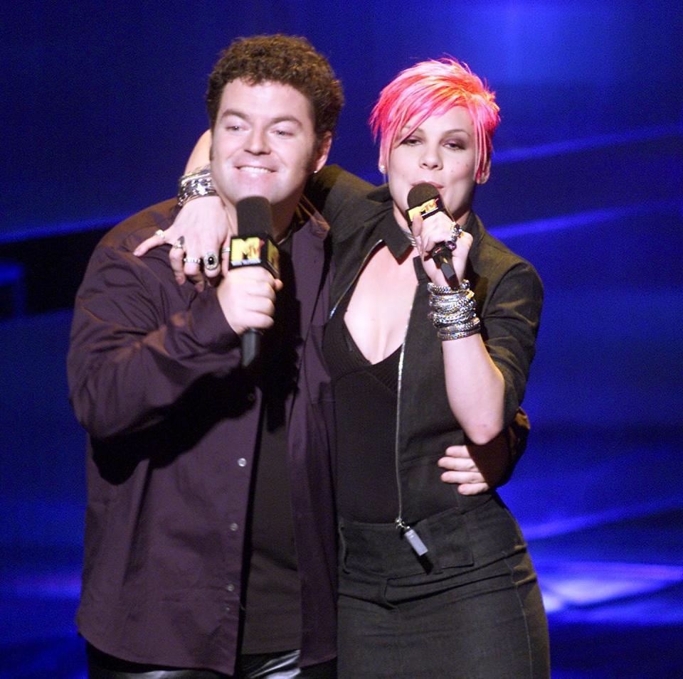 In 2000, Holmes and P!nk emceed the&nbsp;Music With A Message: World AIDS Day concert in New York.&nbsp; (Photo: Getty)