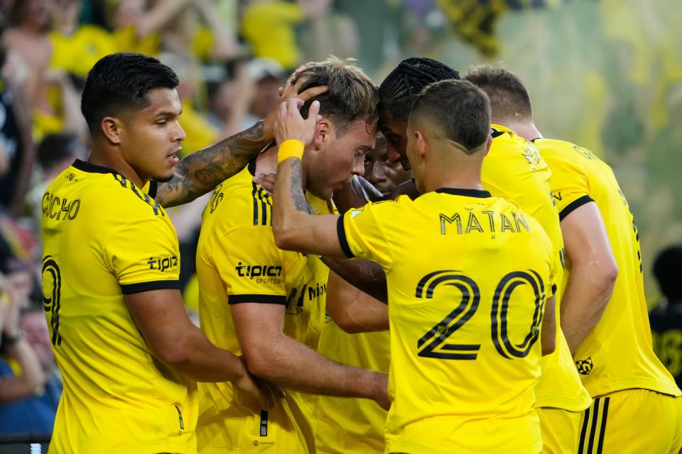 Teammates celebrate a goal by Crew midfielder Aidan Morris on Sunday.