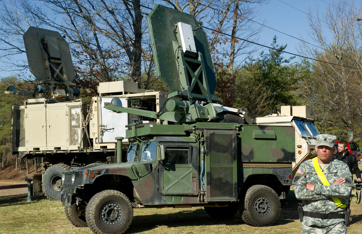 Two versions of US Marine Corps trucks are seen carrying the Active Denial System, March 9th, 2012,  at the US Marine Corps Base Quantico, Virginia. (Paul J. Richards /AFP via Getty Images)