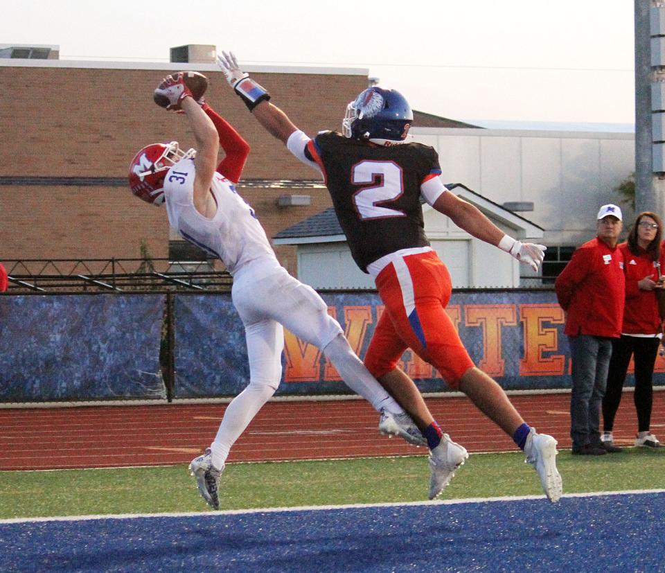 Martinsville senior Chase Mabry makes a great catch for a touchdown from junior quarterback Tyler Adkins during Friday's Mid-State game at Whiteland. 