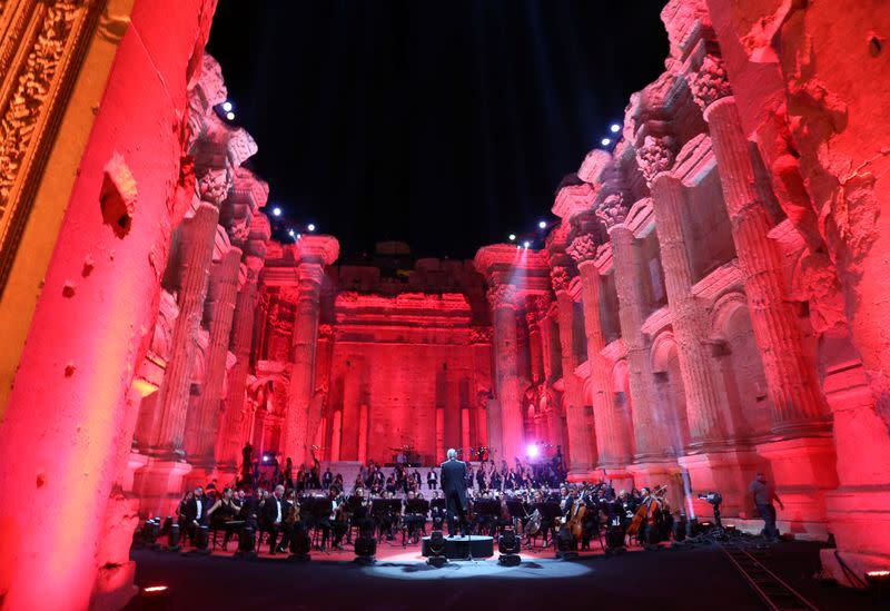 Musicians from Lebanon's philharmonic orchestra are seen on stage before the start of "Sound of Resilience" concert of the Baalbeck music festival, which was broadcasted live with no audience