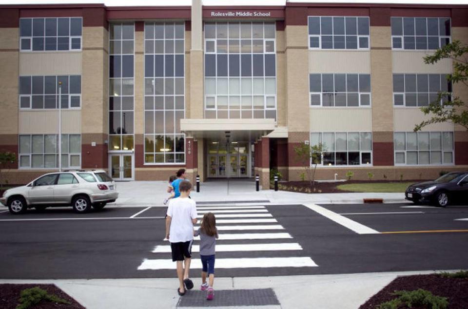 Students arrive at Rolesville Middle School on July 5, 2012 in Rolesville, N.C. to pick up their schedules and orient themselves to the new school that opened that year. Rolesville Middle may convert to a traditional calendar in 2025 due to lack of students.