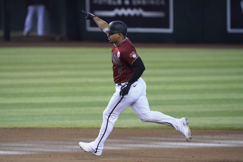 Arizona Diamondbacks' Eduardo Escobar reacts after hitting a three-run home run against the San Diego Padres in the eighth inning during a baseball game, Sunday, Aug 16, 2020, in Phoenix. (AP Photo/Rick Scuteri)