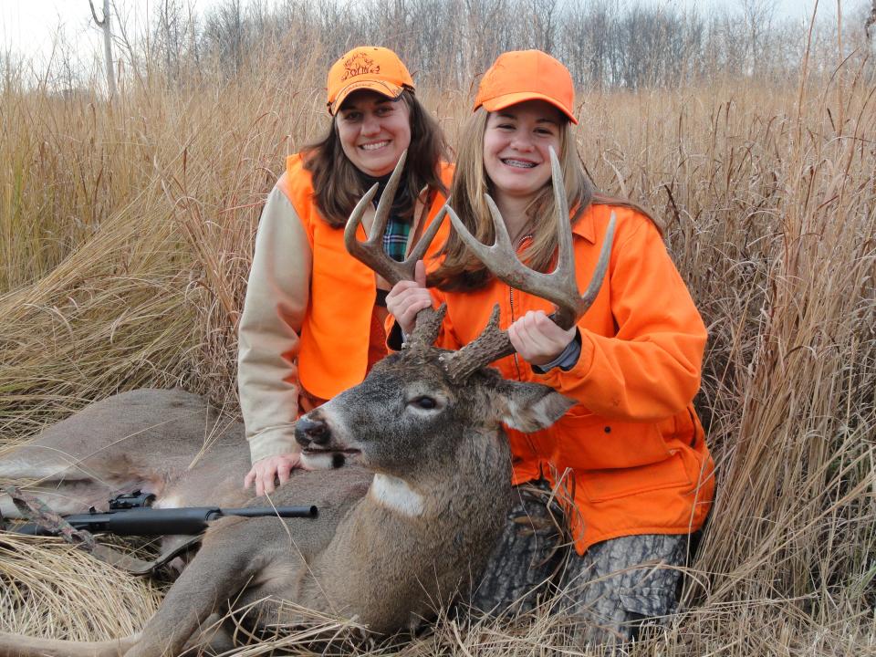 Sarah Schott and her mother, Kelly, smile in November of 2012 with the first buck the young hunter ever harvested.