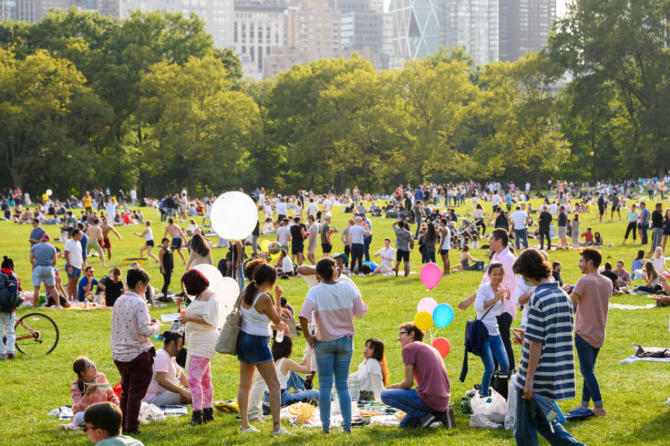 People fill Sheep Meadow in Central Park as the city continues Phase 4 of re-opening following restrictions imposed to slow the spread of coronavirus on September 26, 2020 in New York City. The fourth phase allows outdoor arts and entertainment, sporting events without fans and media production. <span class="copyright">Noam Galai-Getty Images</span>