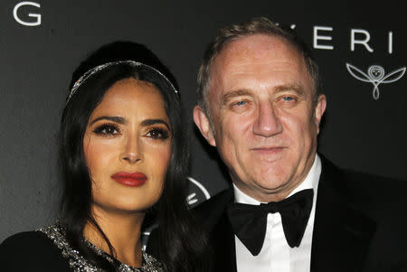 72nd Cannes Film Festival - The Kering Women In Motion Honor Awards as part of Cannes Film Festival Presidential dinner - Arrivals - Cannes, France, May 19, 2019. Salma Hayek and Francois-Henri Pinault pose. REUTERS/Regis Duvignau