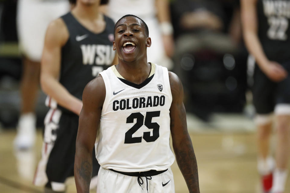 Colorado guard McKinley Wright IV jokes with teammates as he heads to the bench late in the second half of an NCAA college basketball game against Washington State Thursday, Jan. 23, 2020, in Boulder, Colo. Colorado won 78-56. (AP Photo/David Zalubowski)