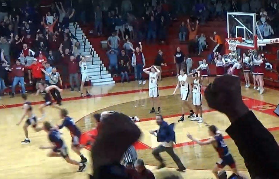 Illini Bluffs players stand in the paint in disbelief after Kameron Hanvey's 3-pointer at the buzzer gave Gibault a  win over the Tigers, 45-44, in the IHSA Class 1A Supersectional in Jacksonville on Monday, March 6, 2023.