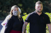 Teacher Kandice Barber, 35, leaves Aylesbury Crown Court, Buckinghamshire, with her husband Daniel, after appearing accused of engaging in illegal sexual activity with a 15-year-old boy.