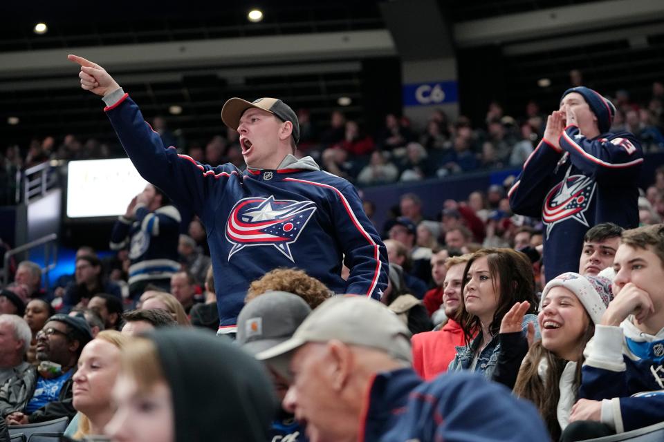 Jan 12, 2023; Columbus, Ohio, USA;  Fans react to a goal by Carolina Hurricanes defenseman Brett Pesce on a play where Columbus Blue Jackets goaltender Joonas Korpisalo lost his mask during the third period of the NHL hockey game at Nationwide Arena. The Blue Jackets lost 6-2. Mandatory Credit: Adam Cairns-The Columbus Dispatch