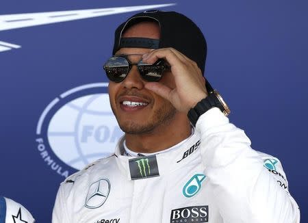 Formula One - F1 - British Grand Prix 2015 - Silverstone, England - 4/7/15 Mercedes' Lewis Hamilton celebrates his pole position in qualifying Reuters / Phil Noble Livepic