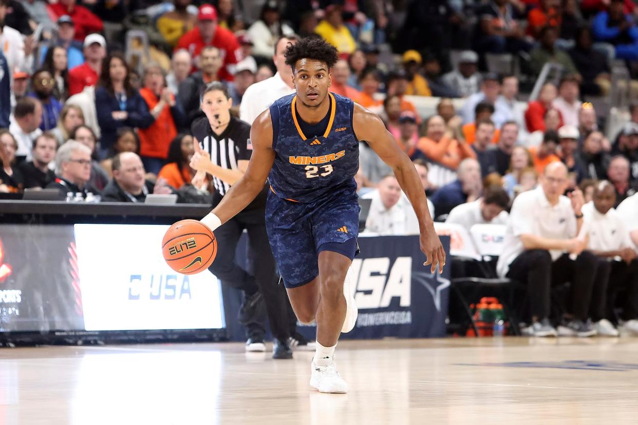 Otis Frazier III brings the ball up the court against Western Kentucky in the Conference USA championship game at Probst Arena in Huntsville