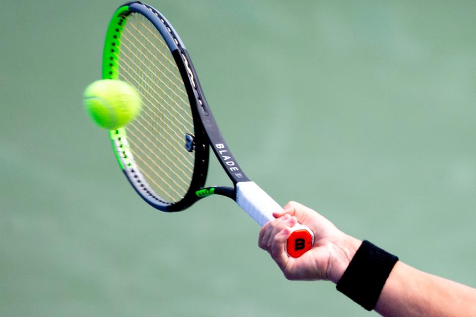 A woman was asked to remove a Ukrainian flag she was wearing Sunday at the Western & Southern Open tennis tournament due to its size, according to tournament officials.