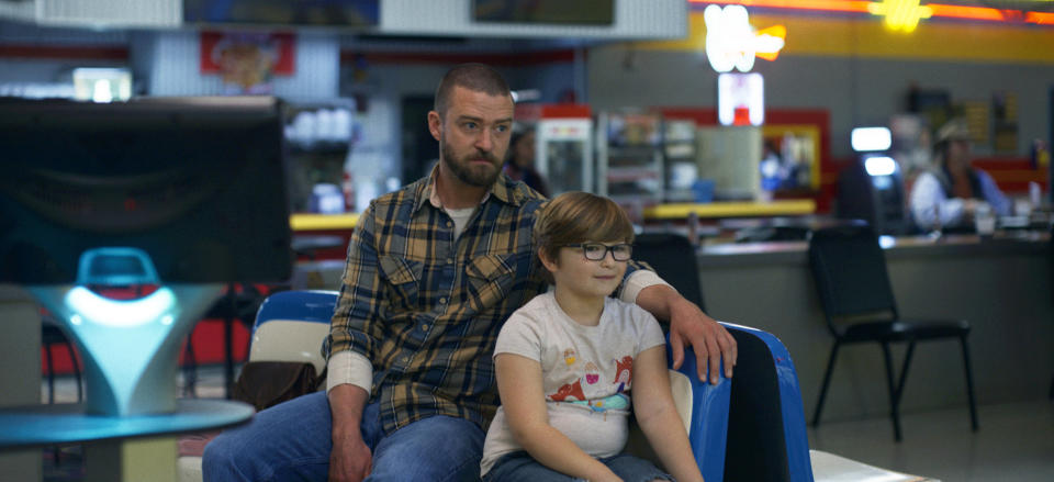 This image released by Apple shows Justin Timberlake, left, and Ryder Allen in a scene from “Palmer.” (Apple via AP)