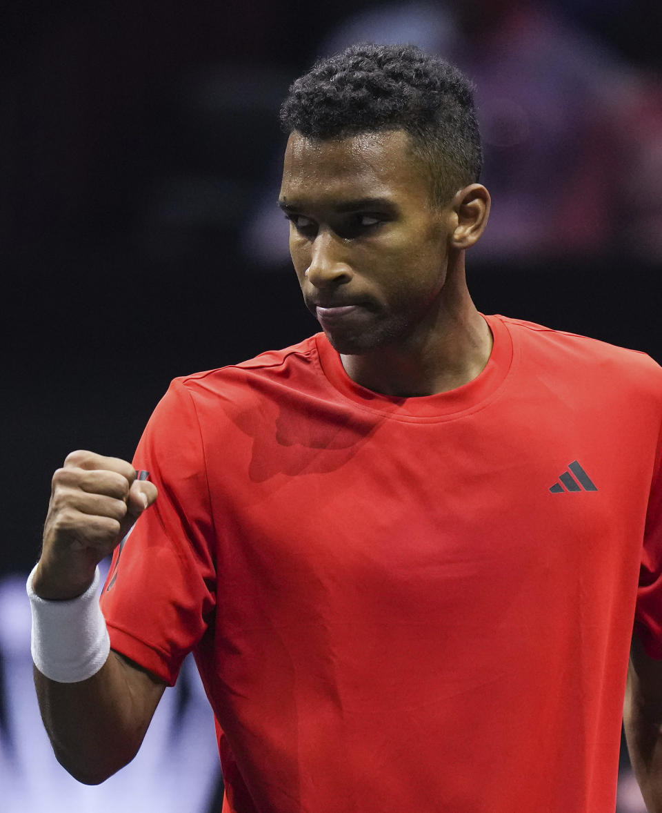 Team World's Felix Auger-Aliassime celebrates a point against Team Europe's Gael Monfils during a Laver Cup tennis match Friday, Sept. 22, 2023, in Vancouver, British Columbia. (Darryl Dyck/The Canadian Press via AP)