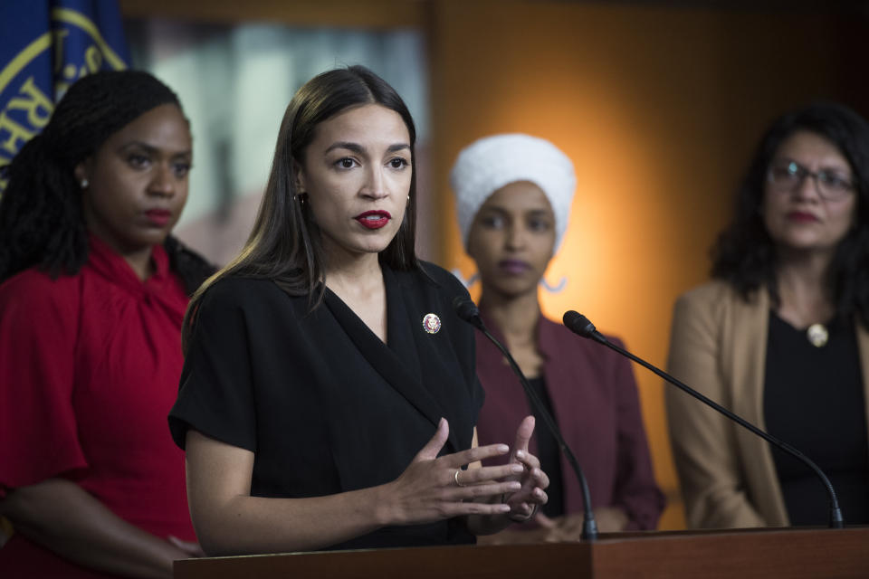 Rep.&nbsp;Alexandria Ocasio-Cortez (D-N.Y.) speaks in July as fellow Squad members and Democratic Reps. Ayanna Pressley (Mass.), Ilhan Omar (Minn.) and Rashida Tlaib (Mich.) look on. (Photo: Tom Williams/CQ Roll Call/Getty Images)