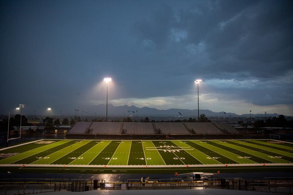 A rain storm rolls in, delaying a high school football game, on Friday, August 25, 2023, at the Field of Dreams.