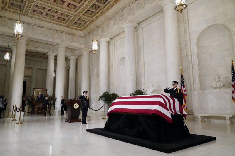 The flag-draped casket of retired Supreme Court Justice Sandra Day O'Connor lies in repose in the Great Hall at the Supreme Court in Washington on Monday. Pool Photo by Jacquelyn Martin/UPI