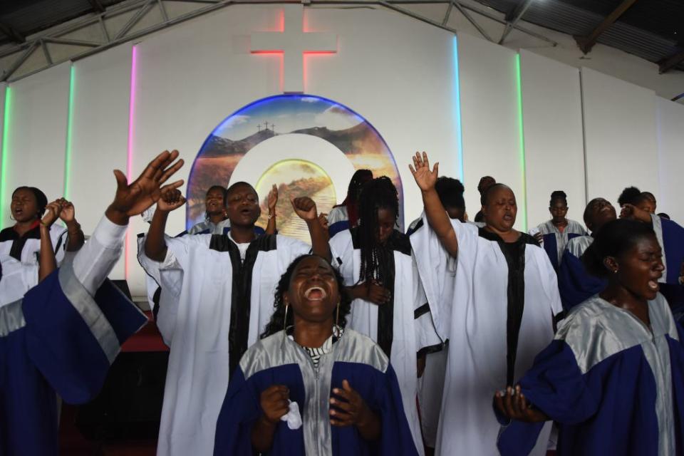 Choir members sing during the Sunday mass without wearing masks and social distancing at Ufunuo na Uzima Church in Dar es Salaam.