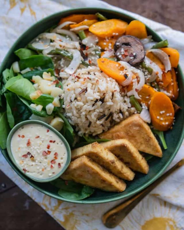 <p>The Edgy Veg</p><p>This one-pan tofu veggie bowl with cashew garlic sauce! It’s dairy-free, vegan and healthy!</p><p><strong>Get the recipe: <a href="https://www.theedgyveg.com/2019/09/03/one-pan-tofu-veggie-bowl-vegan/" rel="nofollow noopener" target="_blank" data-ylk="slk:One-Pan Tofu Veggie Rice Bowl;elm:context_link;itc:0;sec:content-canvas" class="link ">One-Pan Tofu Veggie Rice Bowl</a></strong></p><p><strong>Related: <a href="https://parade.com/844854/pamnelson/20-rice-recipes-to-remember/" rel="nofollow noopener" target="_blank" data-ylk="slk:20 Rice Recipes to Remember;elm:context_link;itc:0;sec:content-canvas" class="link ">20 Rice Recipes to Remember</a></strong></p>