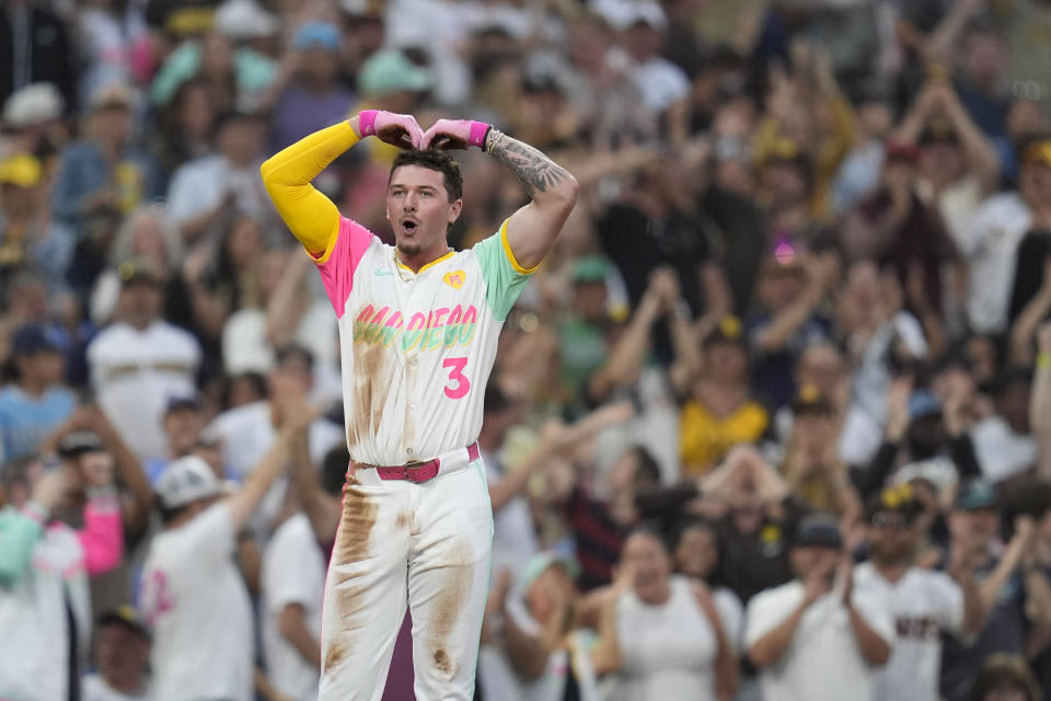 San Diego Padres' Jackson Merrill celebrates after hitting a two-RBI triple during the fourth inning of a baseball game against the Arizona Diamondbacks, Friday, July 5, 2024, in San Diego. (AP Photo/Gregory Bull)