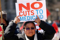 Activists protest against the Republican plan to repeal Obamacare during a rally in Freedom Plaza in Washington March 23, 2017. REUTERS/Kevin Lamarque