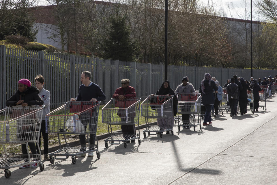 LONDON, ENGLAND - MARCH 16: Shoppers form long queues ahead of the opening of a Costco wholesale store in Chingford on March 16, 2020 in London, England. Coronavirus (Covid-19) has spread to over 156 countries in a matter of weeks, claiming over 6,500 lives and infecting over 170,000. There are currently 1391 diagnosed cases in the UK and 35 deaths. (Photo by Dan Kitwood/Getty Images)