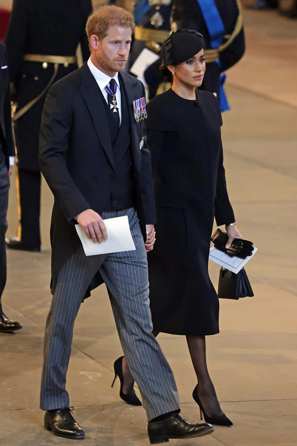 Prince Harry, Duke of Sussex and Meghan, Duchess of Sussex leave Westminster Hall on September 14, 2022 in London, United Kingdom. Queen Elizabeth II's coffin is taken in procession on a Gun Carriage of The King's Troop Royal Horse Artillery from Buckingham Palace to Westminster Hall where she will lay in state until the early morning of her funeral. Queen Elizabeth II died at Balmoral Castle in Scotland on September 8, 2022, and is succeeded by her eldest son, King Charles III.