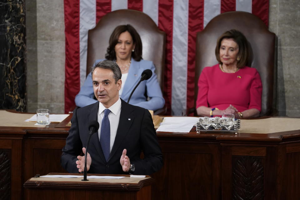 Speaker of the House Nancy Pelosi of Calif., right, and Vice President Kamala Harris, left, listen as Greek Prime Minister Kyriakos Mitsotakis delivers remarks to a joint session of Congress, Tuesday, May 17, 2022, in Washington. (AP Photo/Evan Vucci)