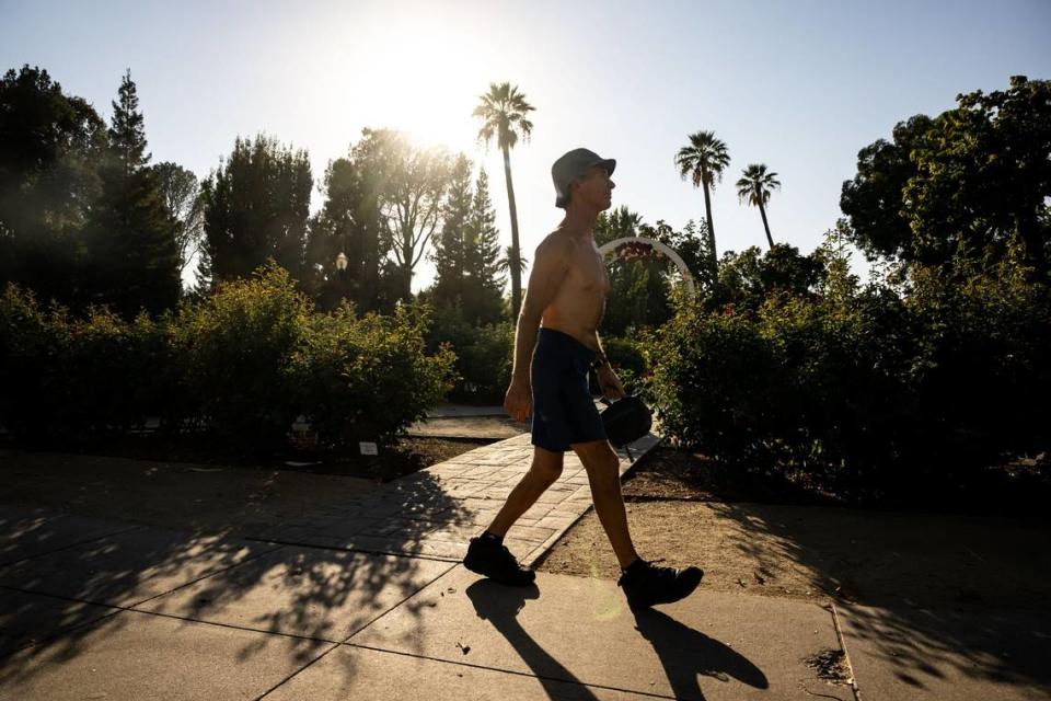 Duane McMullen, of Sacramento, walks along 15th Street past Capitol Park on Tuesday, Sept. 6, 2022, in downtown Sacramento. Todays the hottest day its been in Sacramento, the resident of 32 years said, referring to the record-breaking temperature of 116 degrees reached moments before, according to the National Weather Service. The previous record was 114 degrees, set on July 17, 1925.