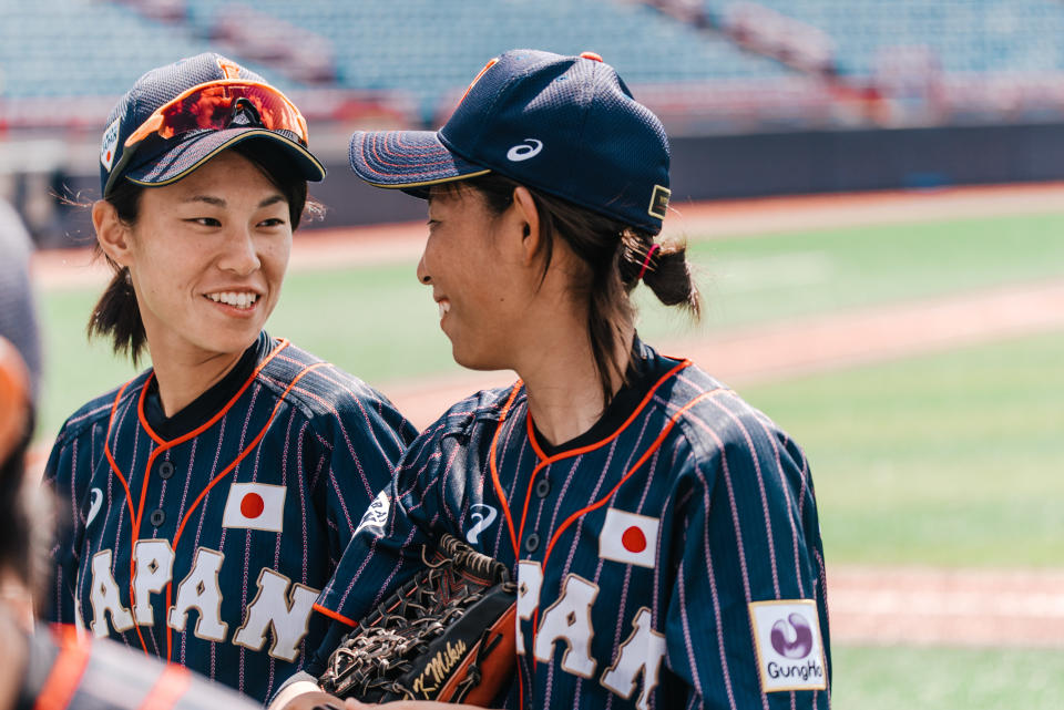 Rina Taniyama (left) and Miku Kitayama (right) talk during the&nbsp;Women's Baseball World Cup as Japan plays against Hong Kong. (Photo: WBSC)