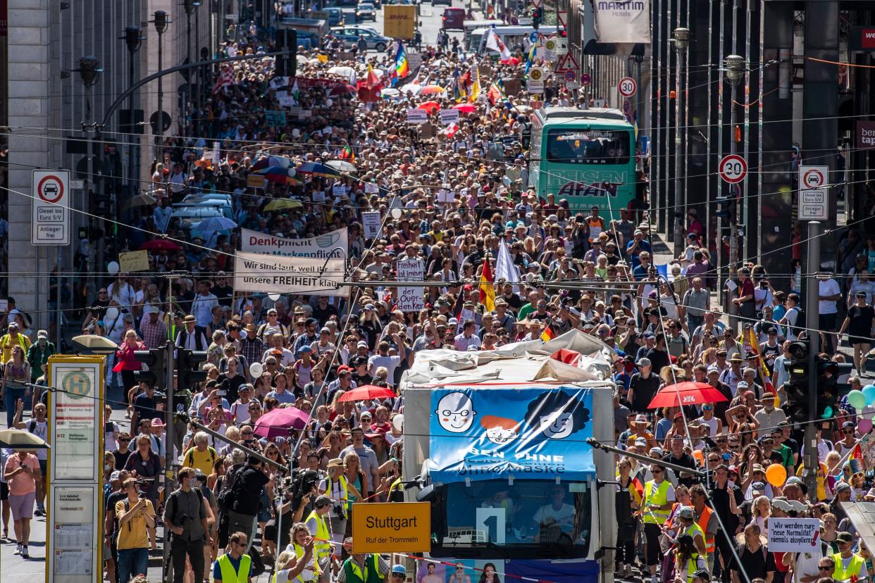 Thousands of demonstrators march down the Friedrichstrasse street as they take part in a demonstration by the initiative "Querdenken-711" with the slogan "the end of the pandemic-the day of freedom" to protest against the current measures to curb the spread of the Coronavirus, in Berlin, on August 1, 2020. (Photo by John MACDOUGALL / AFP) (Photo by JOHN MACDOUGALL/AFP via Getty Images)