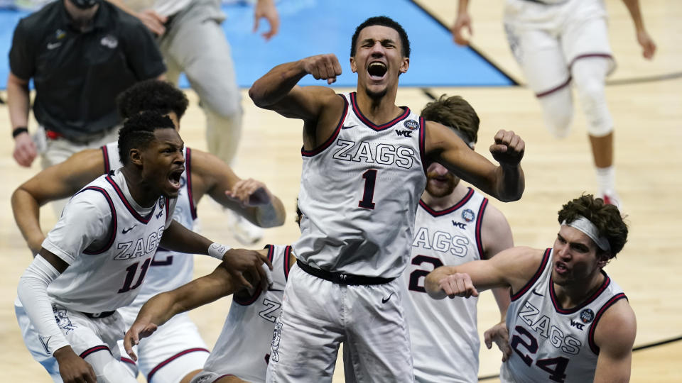 Gonzaga guard Jalen Suggs (1) celebrates making the game winning basket against UCLA during overtime in a men's Final Four NCAA college basketball tournament semifinal game, Saturday, April 3, 2021, at Lucas Oil Stadium in Indianapolis. Gonzaga won 93-90. (AP Photo/Michael Conroy)