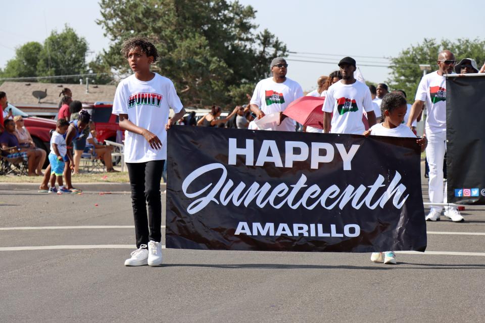 Amarillo comes together to celebrate the 2022 Juneteenth Parade along North Hughes Street to Bones Hooks Park Saturday.