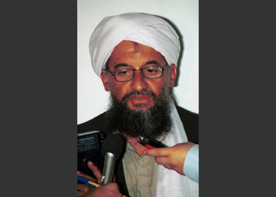 FILE - In this in this 1998 file photo made available Friday, March 19, 2004, Ayman al-Zawahri speaks to the press in Khost, Afghanistan. In a recorded message posted on militant websites late Friday, April 4, 2014, the leader of al-Qaida endorsed a previous call for Islamic arbitration by the al-Qaida-linked Nusra Front over the death of Abu Khaled al-Suri, who it and its allies say was killed by the Islamic State of Iraq and the Levant. (AP Photo/Mazhar Ali Khan, File)