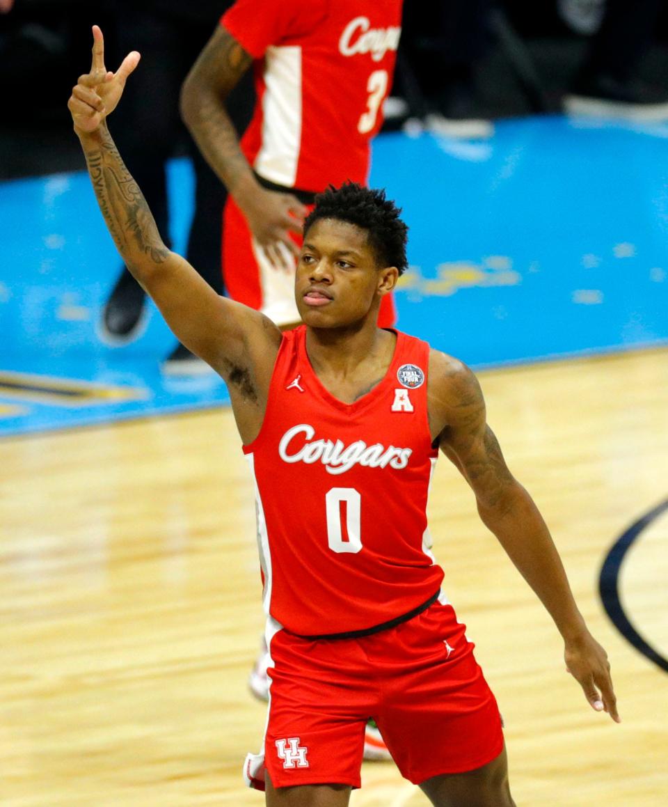 Houston Cougars guard Marcus Sasser (0) celebrates after hitting a three-pointer against Baylor during the semifinals of the Final Four of the 2021 NCAA Tournament . Sasser and the No. 2 Cougars visit UC Sunday.