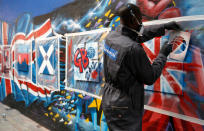 Eric Boateng of the Standard Life Great Britain Men's Basketball team paints a graffiti canvas during a players day at Unity Radio HQ, on July 16, 2012 in Manchester, England. (Photo by Paul Thomas /Getty Images for Standard Life)