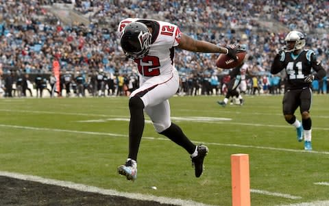 Mohamed Sanu #12 of the Atlanta Falcons runs for a touchdown against the Carolina Panthers in the third quarter during their game at Bank of America Stadium on December 23, 2018 in Charlotte, North Carolina - Credit: Getty