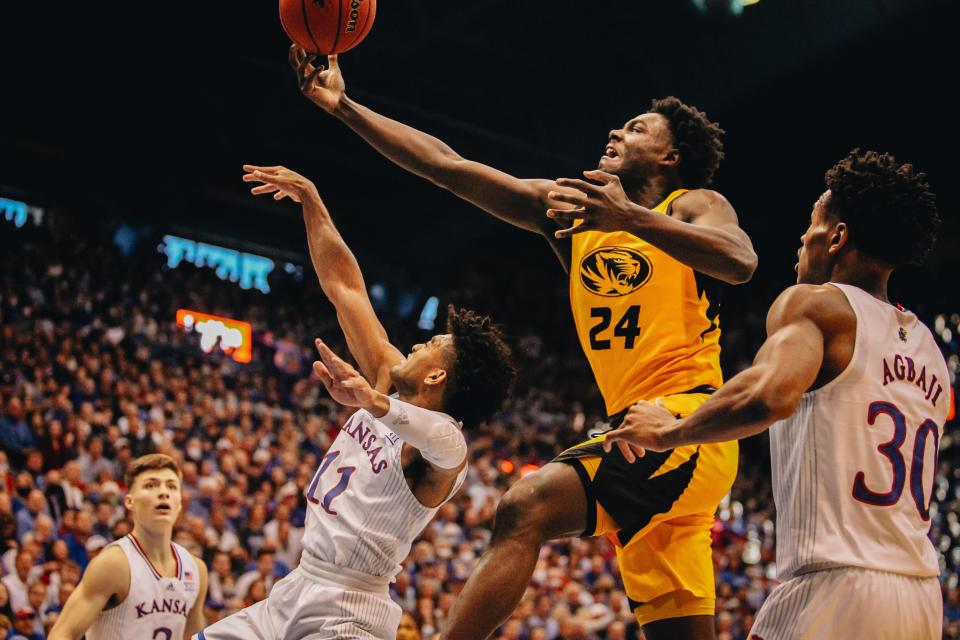 Missouri's Kobe Brown lays up the ball in the first half of the Tigers' Border War rivalry game against Kansas on Dec. 11, 2021.