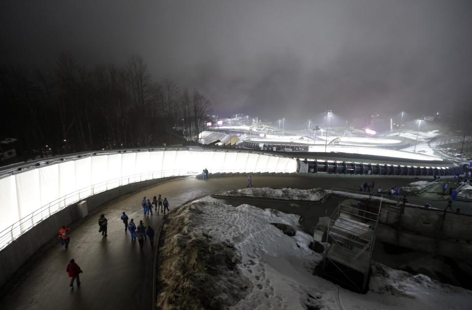 Fog settles in the Sanki Sliding Center during the men's two-man bobsled competition at the 2014 Winter Olympics, Sunday, Feb. 16, 2014, in Krasnaya Polyana, Russia. (AP Photo/Natacha Pisarenko)