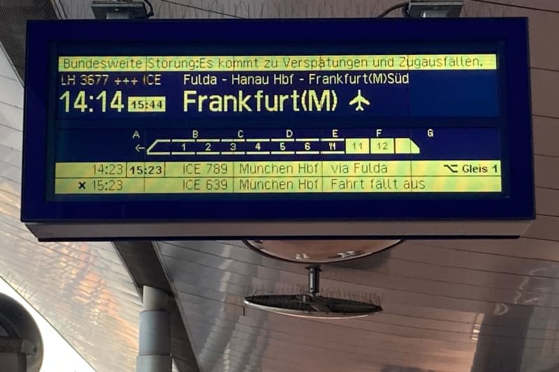 A Deutsche Bahn display at the station shows a delay. German train passengers are bracing for long delays after a major IT outage caused significant disruptions to services in central Germany, operator Deutsche Bahn said on Saturday. Verena Schmitt-Roschmann/dpa