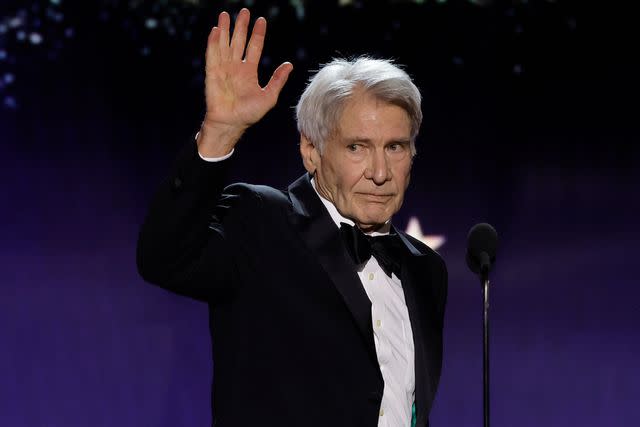 <p>Kevin Winter/Getty </p> Harrison Ford waved to the crowd at the 29th Annual Critics Choice Awards.