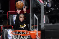 Golden State Warriors guard Stephen Curry shoots as players warm up for the team's NBA basketball game against the Brooklyn Nets, Tuesday, Dec. 22, 2020, in New York. (AP Photo/Kathy Willens)