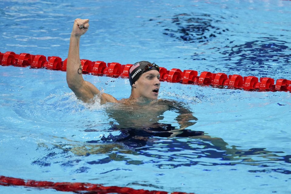 FILE - Caeleb Dressel, of the United States, celebrates after winning the gold medal in the men's 50-meter freestyle final at the 2020 Summer Olympics, Aug. 1, 2021, in Tokyo, Japan. The world swimming championships start in Budapest on Saturday June 18, 2022, where Caeleb Dressel is going for his third consecutive world titles in the 50, 100 free and 100 butterfly. (AP Photo/Jae C. Hong, File)
