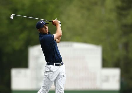 Jordan Spieth of the U.S. hits off the 14th fairway during final round play of the Masters golf tournament at the Augusta National Golf Course in Augusta, Georgia April 12, 2015. REUTERS/Mark Blinch