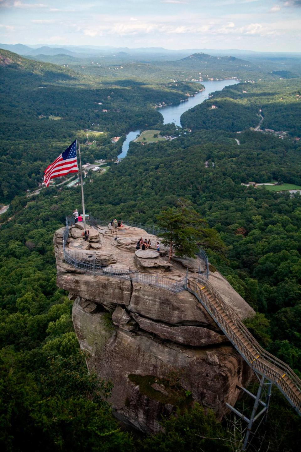 Visitors atop Chimney Rock get a view of Hickory Nut Gorge and Lake Lure at Chimney Rock State Park.