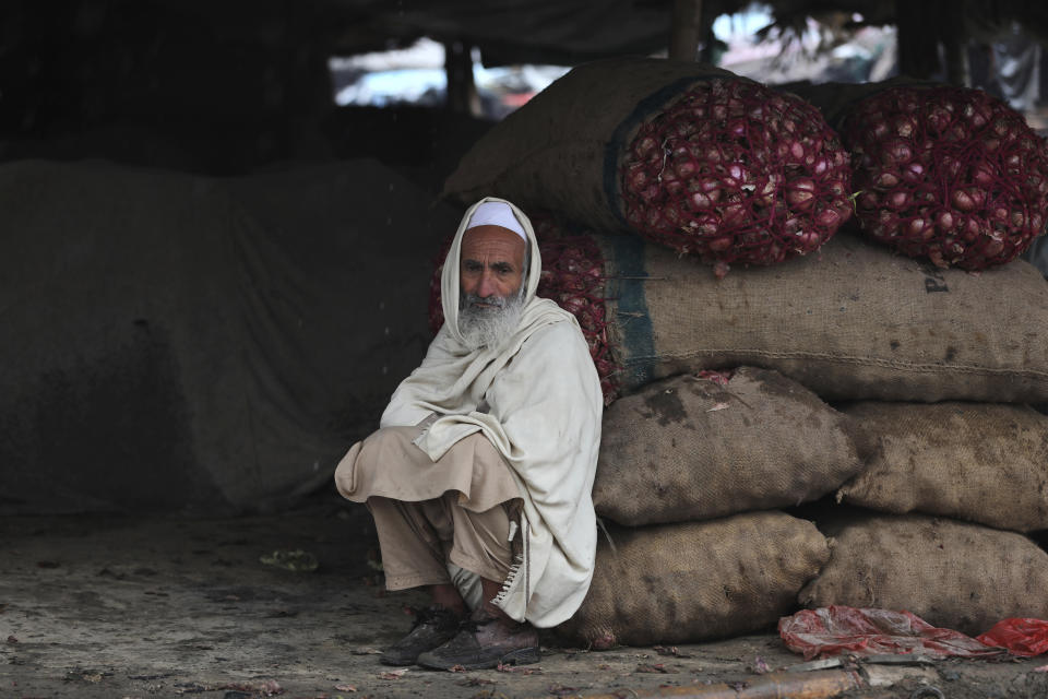 FILE - A produce vendor waits for customers at a market in Islamabad, Pakistan, on Jan. 22, 2022. Growing numbers of people in Asia lack enough food to eat as food insecurity rises with higher prices and worsening poverty, according to a report by the Food and Agricultural Organization and other UN agencies released Tuesday, Jan. 24, 2023. (AP Photo/Rahmat Gul, File)