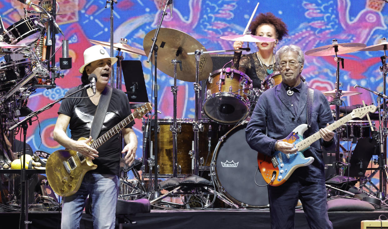  Carlos Santana (left) and Eric Clapton perform at the Crossroads Guitar Festival at the Crypto.com Arena in Los Angeles on September 24, 2023. 