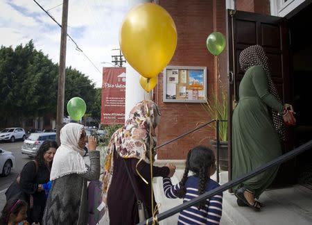 Muslim women arrive for the prayer service at the Women's Mosque of America in downtown Los Angeles, California January 30, 2015. The first mosque in the United States to be solely dedicated to women launched with a women-led prayer service. REUTERS/Lori Shepler (UNITED STATES - Tags: RELIGION SOCIETY)