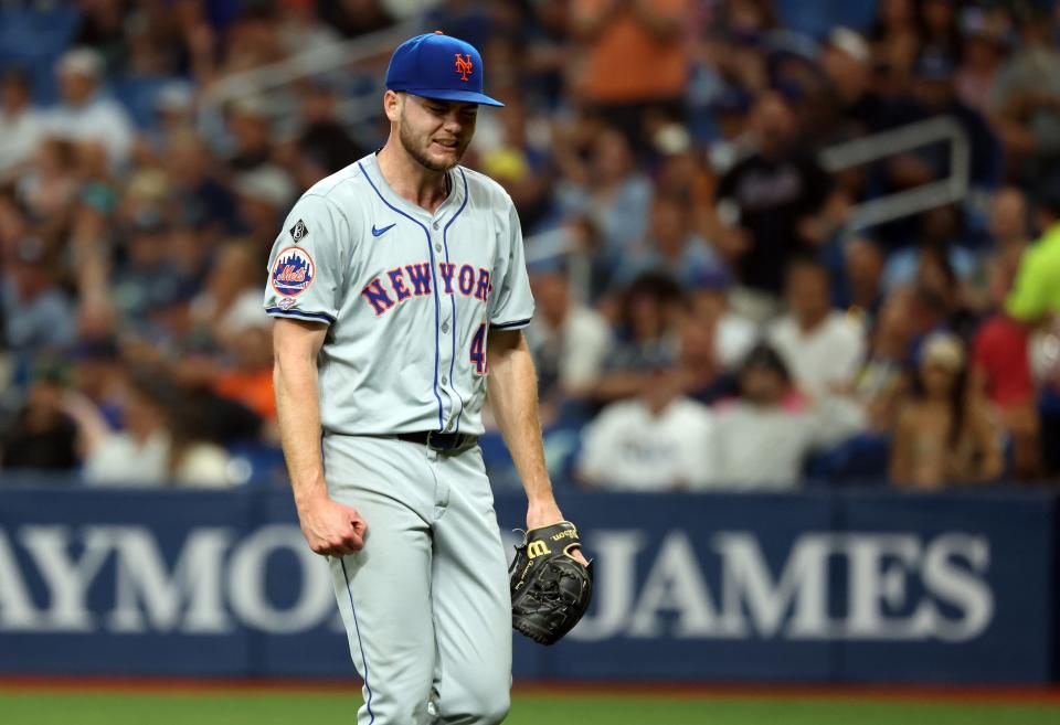 New York Mets starting pitcher Christian Scott (45) reacts at the end of the first inning against the Tampa Bay Rays on May 4, 2024, at Tropicana Field.